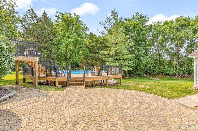 113 Riverwalk Dr, Desloge, MO 63628 - view of grassy yard with a wooden deck, a patio area, an outdoor pool, and stairway