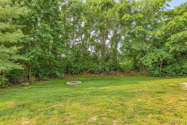 113 Riverwalk Dr, Desloge, MO 63628 - view of grassy yard featuring an outdoor fire pit