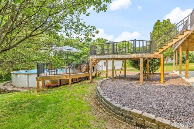 113 Riverwalk Dr, Desloge, MO 63628 - view of grassy yard with stairway, a deck, and an outdoor pool