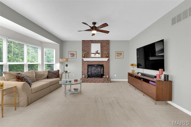 2654 Breckenridge Cir, Ofallon, MO 63368 - carpeted living area with ceiling fan, a fireplace, and baseboards