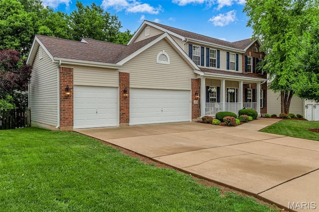 2654 Breckenridge Cir, Ofallon, MO 63368 - view of front of house featuring covered porch, driveway, a front yard, a shingled roof, and a garage
