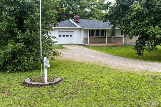 24506 State Road A, Richland, MO 65556 - ranch-style home featuring driveway, a garage, a front lawn, and a chimney
