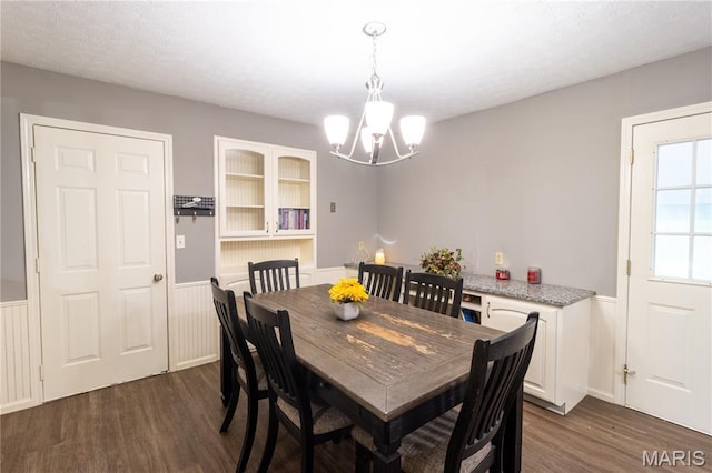24506 State Road A, Richland, MO 65556 - dining room with dark wood-type flooring, wainscoting, and a chandelier