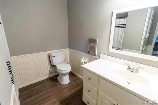 24506 State Road A, Richland, MO 65556 - full bathroom featuring wood finished floors, a wainscoted wall, toilet, vanity, and heating unit