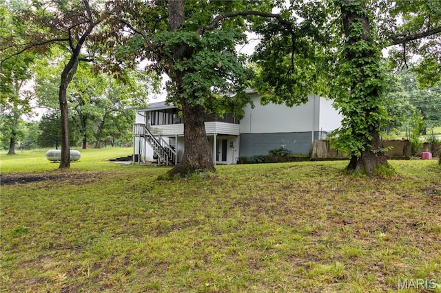 24506 State Road A, Richland, MO 65556 - view of grassy yard with a sunroom and stairway