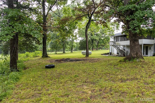 24506 State Road A, Richland, MO 65556 - view of green lawn with a sunroom and stairway