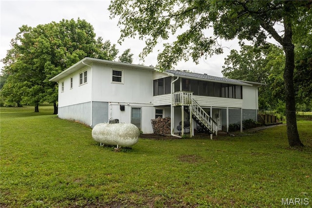 24506 State Road A, Richland, MO 65556 - back of house featuring a sunroom, a yard, and stairway