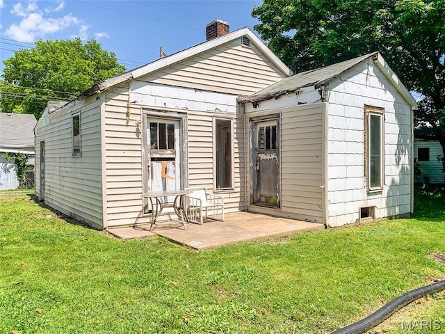 526 State St, Dupo, IL 62239 - back of property with a chimney and a yard