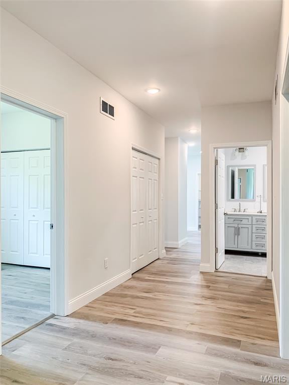 526 State St, Dupo, IL 62239 - unfurnished room with light wood-style floors, a sink, and baseboards