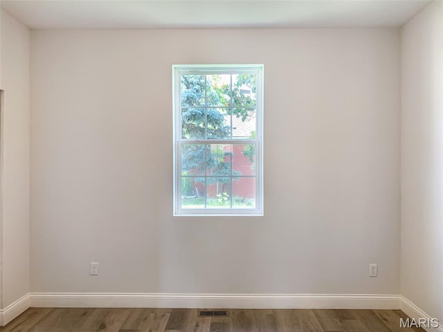 526 State St, Dupo, IL 62239 - empty room with wood finished floors and baseboards
