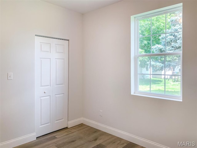 526 State St, Dupo, IL 62239 - unfurnished room with baseboards, healthy amount of natural light, and light wood-style floors