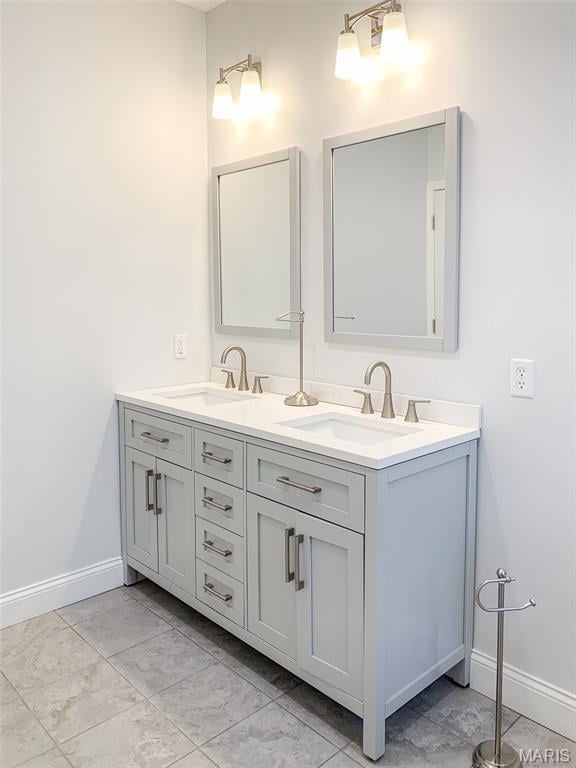 526 State St, Dupo, IL 62239 - bathroom featuring baseboards, double vanity, and marble finish floors