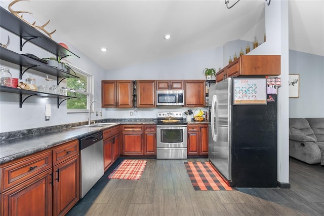 7172 Briarwood Dr, Cedar Hill, MO 63016 - kitchen with stainless steel appliances, lofted ceiling, dark countertops, a sink, and dark wood finished floors