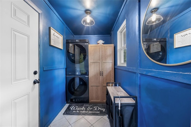 7172 Briarwood Dr, Cedar Hill, MO 63016 - washroom featuring stacked washer / drying machine, tile patterned floors, and cabinet space