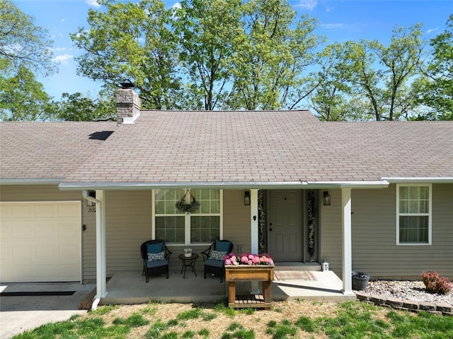 7172 Briarwood Dr, Cedar Hill, MO 63016 - view of front of home with a porch, an attached garage, a chimney, and concrete driveway