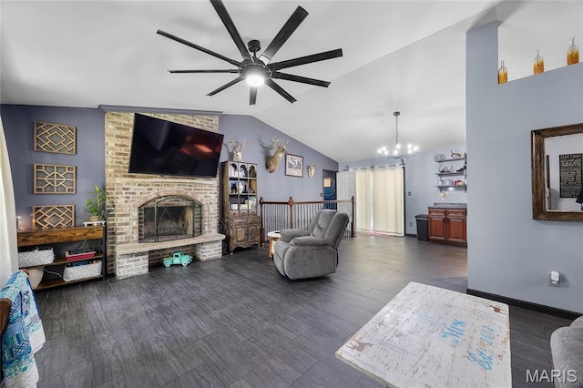 7172 Briarwood Dr, Cedar Hill, MO 63016 - living area featuring a ceiling fan, vaulted ceiling, dark wood-style floors, a chandelier, and a fireplace
