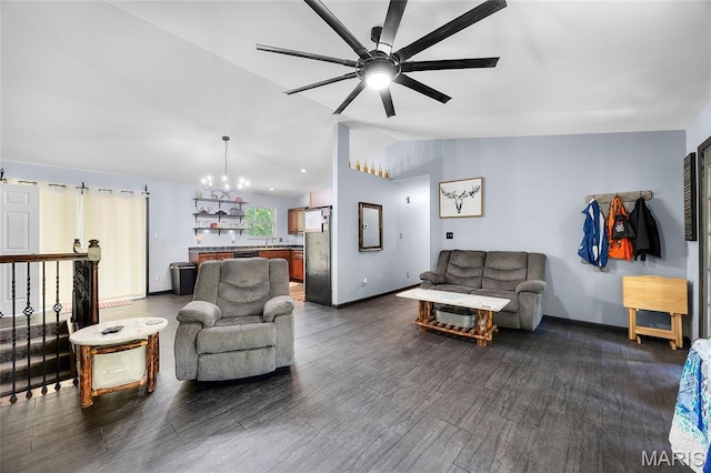 7172 Briarwood Dr, Cedar Hill, MO 63016 - living room with lofted ceiling, a ceiling fan, a chandelier, and dark wood-type flooring