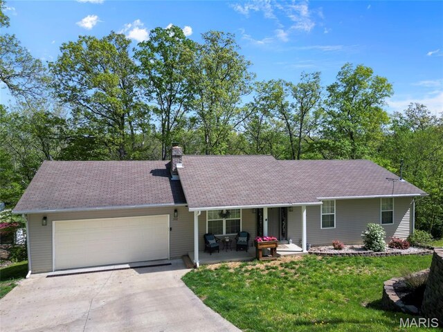 7172 Briarwood Dr, Cedar Hill, MO 63016 - ranch-style home featuring concrete driveway, a garage, a porch, a chimney, and a front lawn