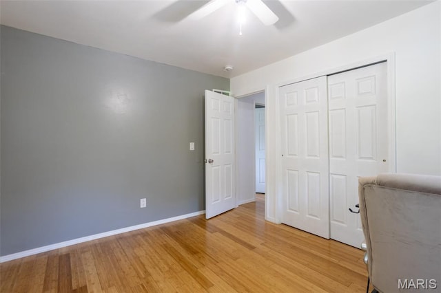 13012 Hencher Rd, De Soto, MO 63020 - unfurnished bedroom with light wood-style flooring, baseboards, a closet, and ceiling fan