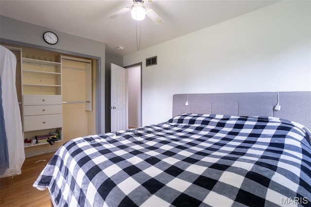 13012 Hencher Rd, De Soto, MO 63020 - bedroom with wood finished floors, a closet, and ceiling fan