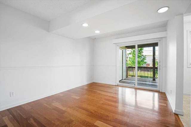 1721 Blue Jay Cv, Saint Louis, MO 63144 - spare room with wood finished floors, baseboards, and recessed lighting