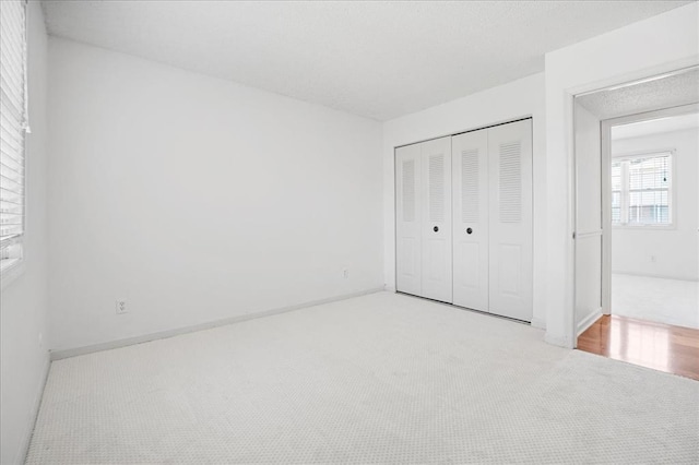 1721 Blue Jay Cv, Saint Louis, MO 63144 - unfurnished bedroom with carpet floors, a closet, and baseboards