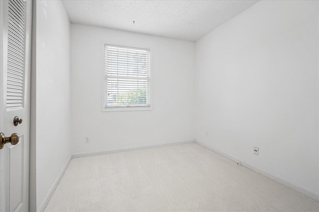 1721 Blue Jay Cv, Saint Louis, MO 63144 - carpeted empty room with a textured ceiling and baseboards