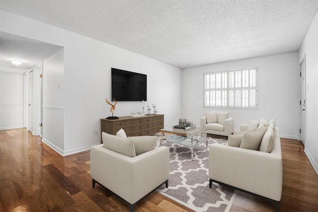 1721 Blue Jay Cv, Saint Louis, MO 63144 - living room with a textured ceiling, wood finished floors, and baseboards