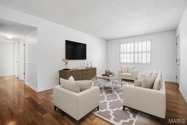 1721 Blue Jay Cv, Saint Louis, MO 63144 - living room featuring a textured ceiling and wood finished floors