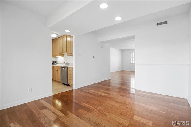 1721 Blue Jay Cv, Saint Louis, MO 63144 - unfurnished living room featuring light wood-style flooring and recessed lighting