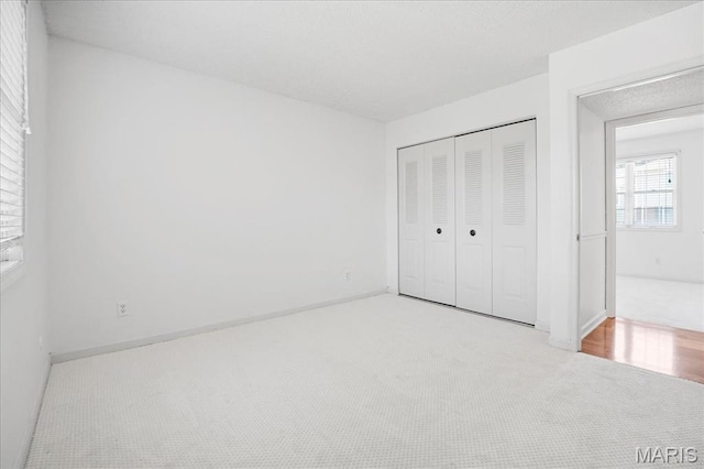 1721 Blue Jay Cv, Saint Louis, MO 63144 - unfurnished bedroom featuring carpet and a closet