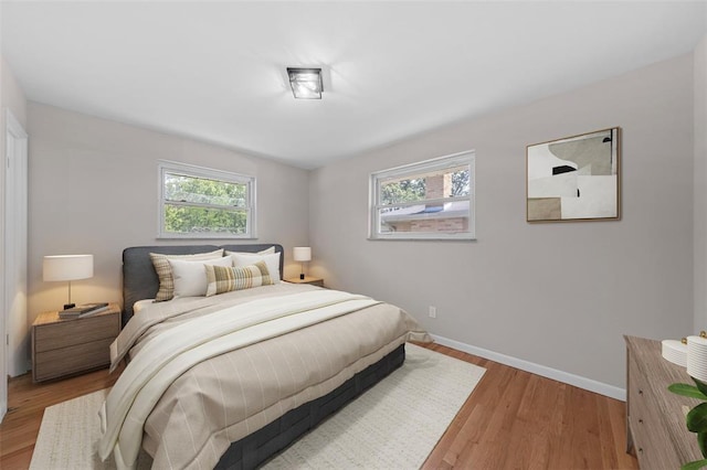 1865 Shardell Dr, Spanish Lake Township, MO 63138 - bedroom featuring light wood-type flooring and baseboards