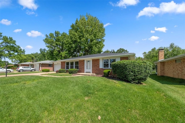 1865 Shardell Dr, Spanish Lake Township, MO 63138 - ranch-style house featuring an attached garage, a front lawn, and driveway