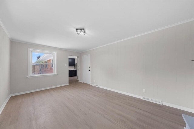 1865 Shardell Dr, Spanish Lake Township, MO 63138 - empty room featuring wood finished floors, ornamental molding, and baseboards