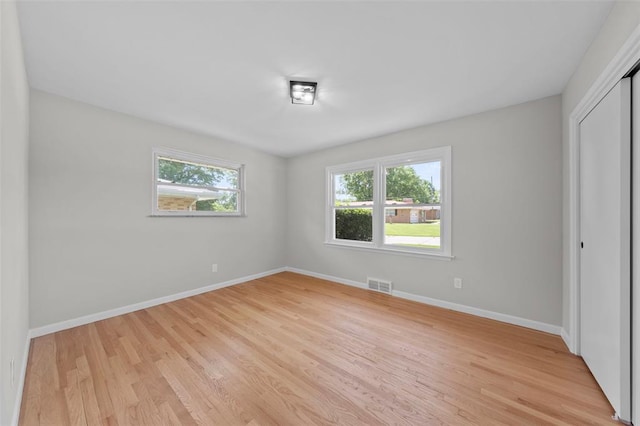 1865 Shardell Dr, Spanish Lake Township, MO 63138 - unfurnished bedroom with light wood-style flooring, baseboards, and a closet