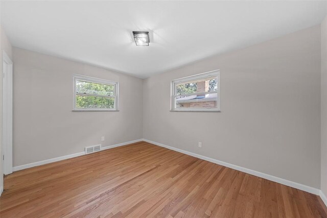 1865 Shardell Dr, Spanish Lake Township, MO 63138 - spare room featuring baseboards and light wood-type flooring