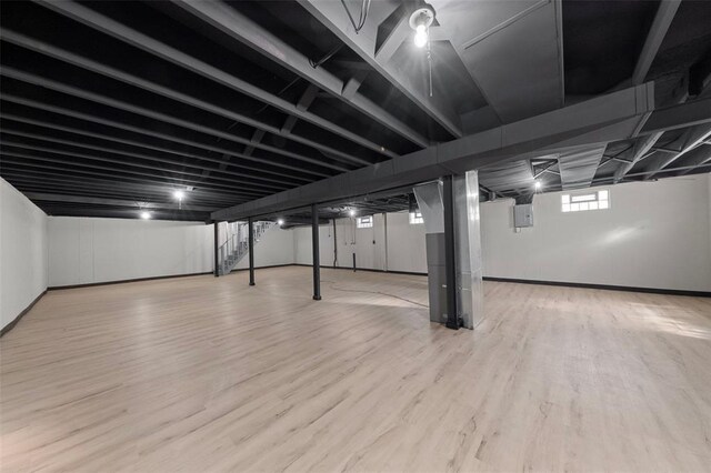1865 Shardell Dr, Spanish Lake Township, MO 63138 - basement featuring wood finished floors, baseboards, and stairs