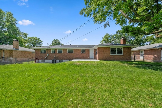 1865 Shardell Dr, Spanish Lake Township, MO 63138 - back of house featuring a chimney, brick siding, a patio area, and central AC
