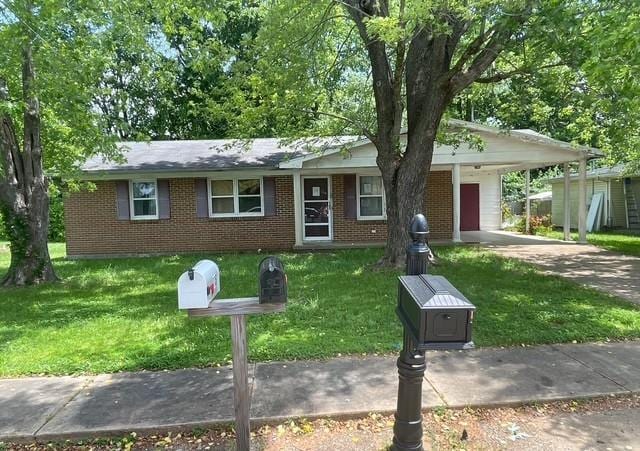 113 Watson St, Fredericktown, MO 63645 - ranch-style home with brick siding, a front lawn, and concrete driveway