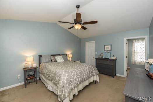 538 Springhurst Pkwy, Ofallon, MO 63368 - bedroom featuring vaulted ceiling, light carpet, baseboards, and a ceiling fan