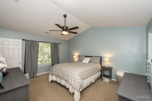 538 Springhurst Pkwy, Ofallon, MO 63368 - bedroom featuring lofted ceiling, baseboards, a ceiling fan, and light colored carpet