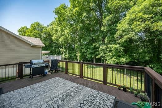 538 Springhurst Pkwy, Ofallon, MO 63368 - wooden deck with area for grilling