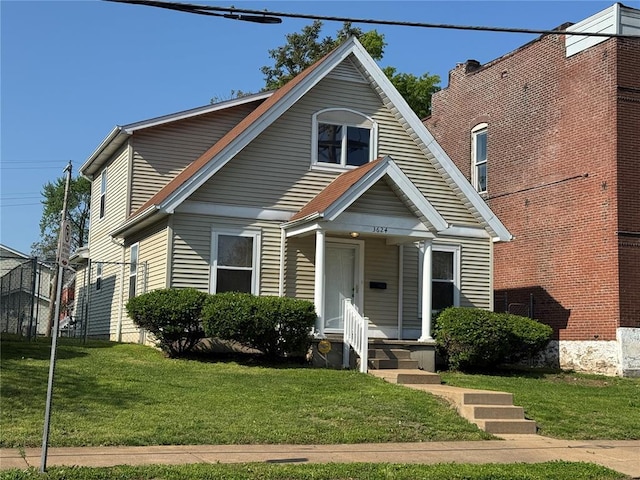 3624 Market St, Saint Louis, MO 63115 - bungalow-style home with a front lawn