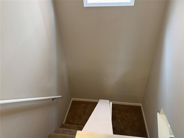 3624 Market St, Saint Louis, MO 63115 - staircase featuring carpet and baseboards