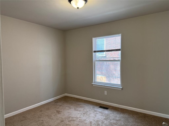 3624 Market St, Saint Louis, MO 63115 - carpeted spare room with baseboards