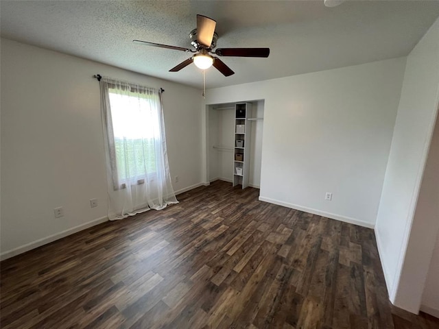 108 Gray St, Sullivan, MO 63080 - unfurnished bedroom featuring dark wood-style floors, a closet, baseboards, and a ceiling fan