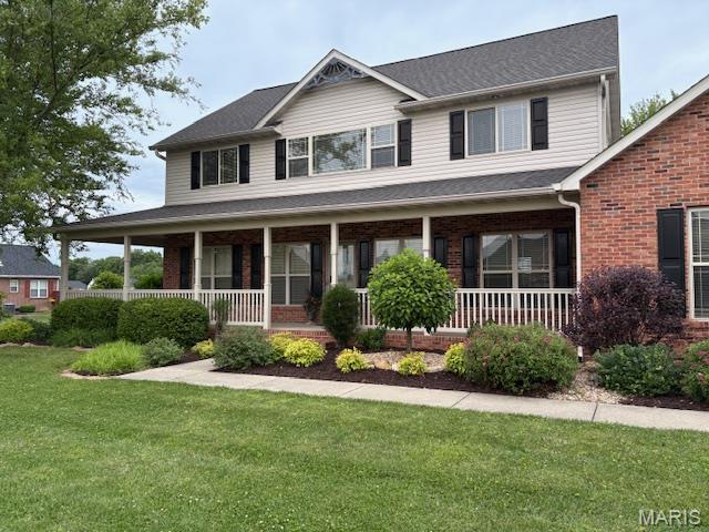 6517 Augies Way Pl, Millstadt, IL 62260 - view of front of home with a porch, brick siding, and a front yard