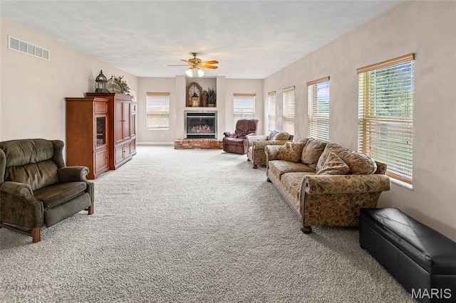 6517 Augies Way Pl, Millstadt, IL 62260 - living area featuring light colored carpet, a ceiling fan, and a brick fireplace