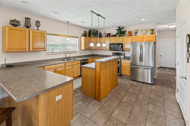 6517 Augies Way Pl, Millstadt, IL 62260 - kitchen featuring stainless steel appliances, a peninsula, dark countertops, decorative light fixtures, and recessed lighting
