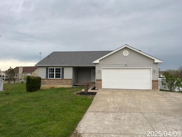 14 Mandy Ct, Troy, MO 63379 - ranch-style home featuring brick siding, driveway, a garage, a front lawn, and a shingled roof